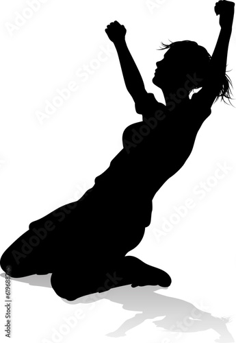 A female soccer football player woman in silhouettes