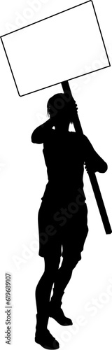Protestor or demonstrator at a demonstration march, picket line or strike protest rally in silhouette. Holding up a banner or picket sign board placard.
