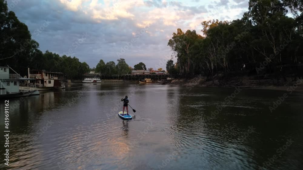 Murray River Sunset with Paddleboarder track to Echuca Murray River Sunset with Paddleboarder track to Echuca