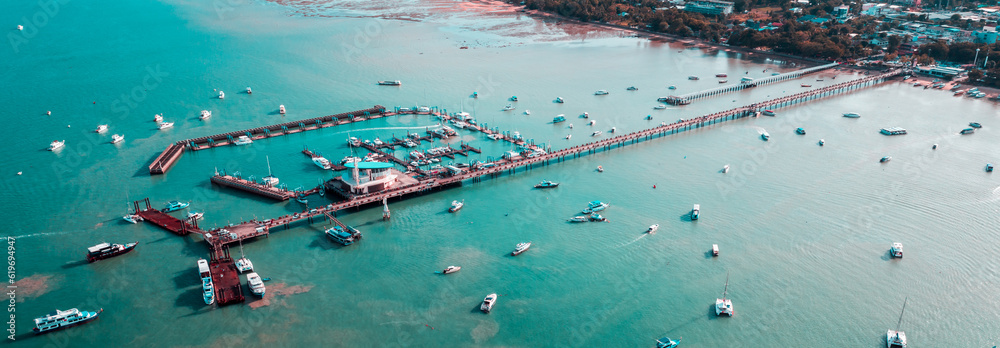 Chalong pier phuket in aerial view. Seascape at yacht club with sailboats.