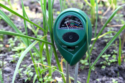 Ph meter for measuring the level of alkali in the ground for plants. A device for monitoring the composition of the soil stuck in the ground
