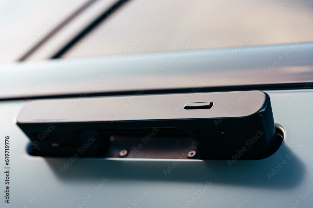 Modern luxury car exterior, close up of a door handle