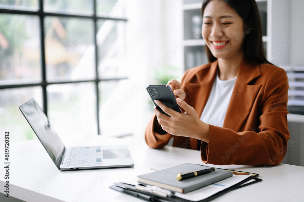 businesswoman working with digital tablet computer and smart phone with financial business strategy layer effect on desk businesswoman working with digital tablet computer and smart phone with financial business strategy layer effect on desk