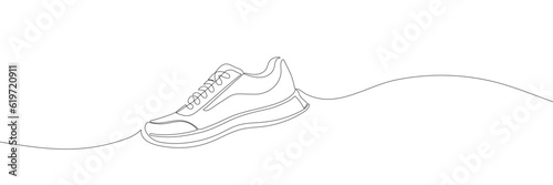 sneakers are drawn with one line. Sports shoes in a linear style. continuous one line. Vector illustration photo