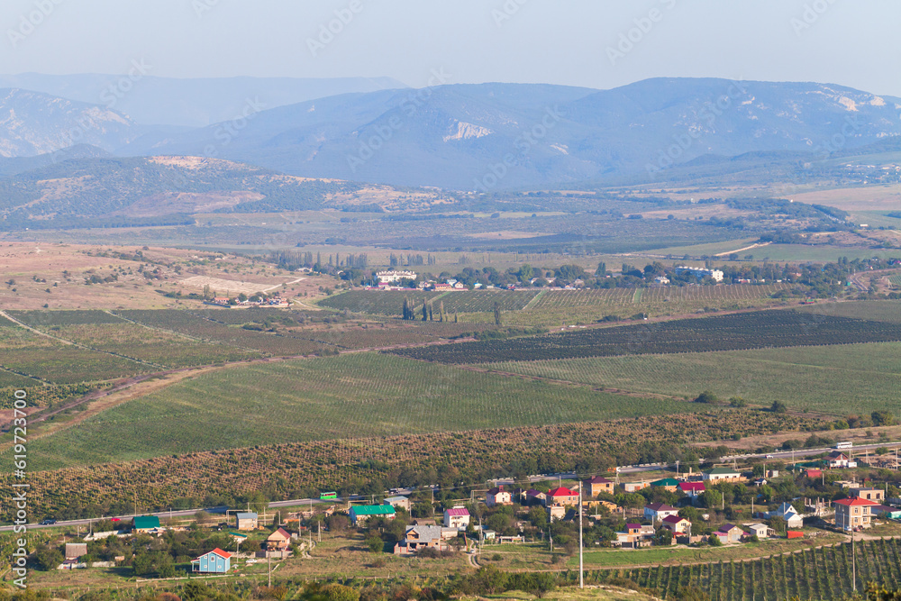Crimean mountains on a sunny summer day under cloudy sky, rural summer landscape