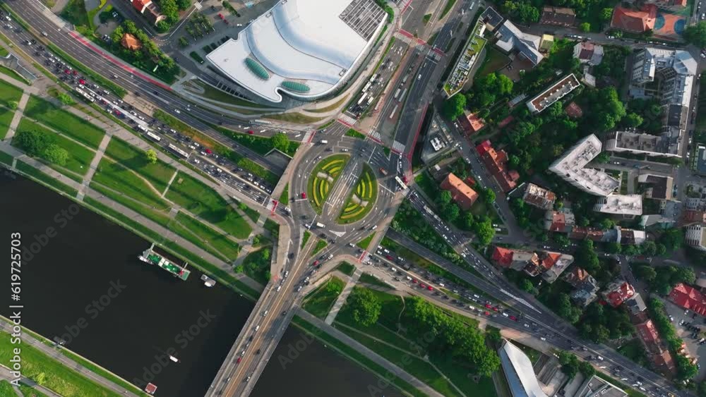 4K. Aerial view of road interchange or highway intersection with busy urban traffic. Flying above road interchange in City. 4K. Aerial view of road interchange or highway intersection with busy urban traffic. Flying above road interchange in City.