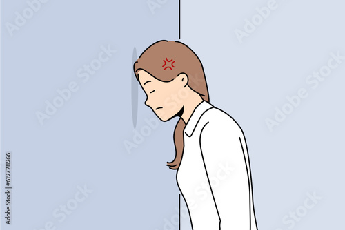 Woman bangs head against wall because of mental problems or failures in personal life. Girl stands with eyes closed, inventing way to solve problems that have arisen and in need of moral support.