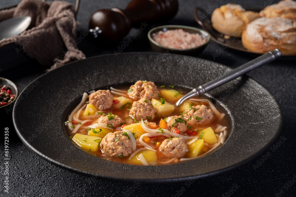 Plate with meatballs soup, traditional plate of the Romanian cuisine - Ciorba de perisoare. Plate with meatballs soup, traditional plate of the Romanian cuisine - Ciorba de perisoare.