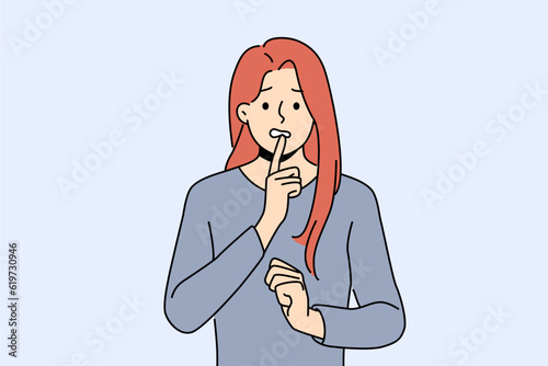 Confused woman touches chin thoughtfully, reflecting on philosophical question or mistake. Confused young girl in casual clothes looks worriedly at screen in need of help or advice