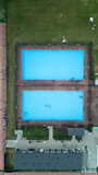 Aerial top down view of swimming pools in the resort.