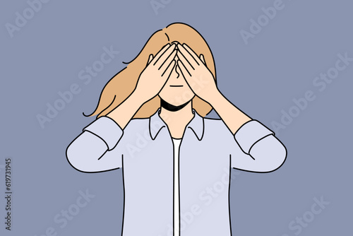 Woman closes eyes in anticipation of surprise or playing with small child. Young girl closes eyes and acts up not wanting to see unpleasant things or trying to hide in order to avoid stress.