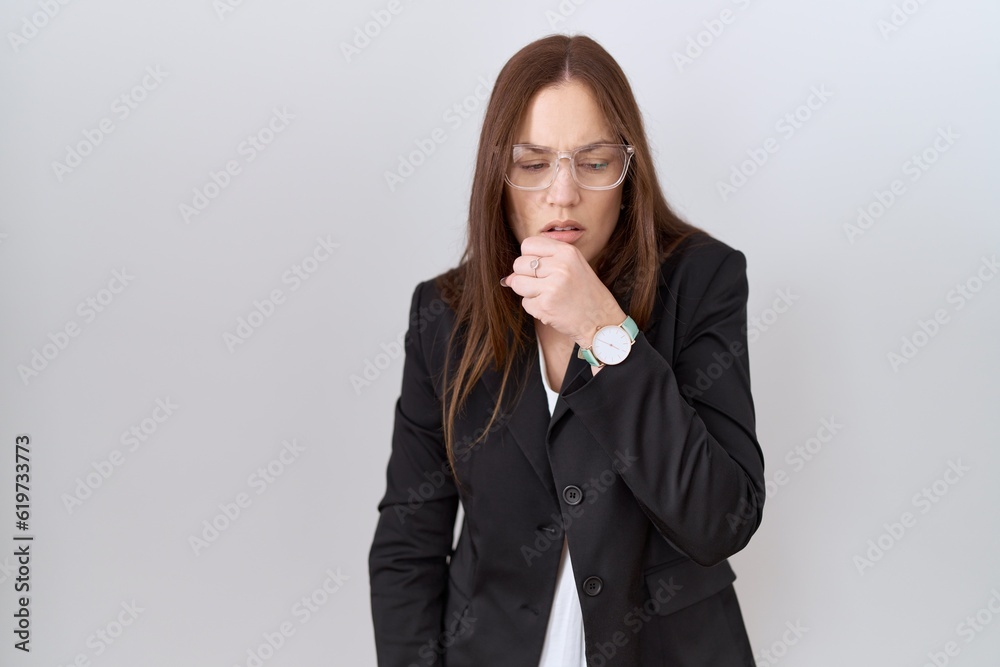 Beautiful brunette woman wearing business jacket and glasses feeling unwell and coughing as symptom for cold or bronchitis. health care concept. Beautiful brunette woman wearing business jacket and glasses feeling unwell and coughing as symptom for cold or bronchitis. health care concept.
