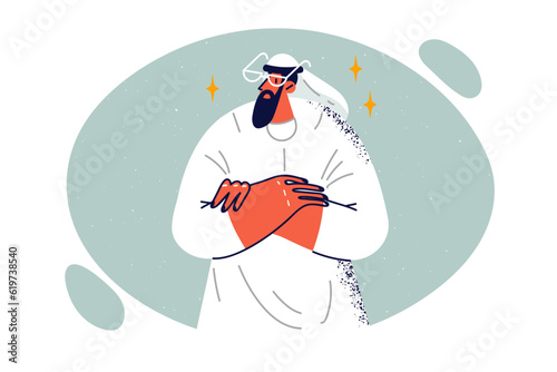 Sheikh in arab dress stands with arms crossed for concept business with investors from Emirates