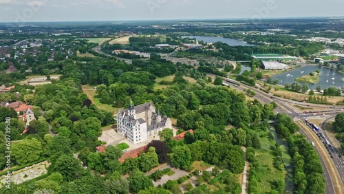 Drone shot of Wolfsburg Castle ( Schloss Wolfsburg ) . The Wolfsburg is a medieval lowland and water castle in North Germany . photo