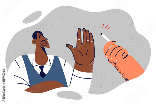 African American man refuses cigarette and wishes stop smoking in order to improve health
