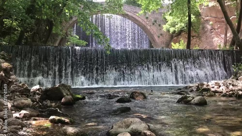 The arch bridge waterfall of Paleokaria, Trikala, Thessaly, Greece photo