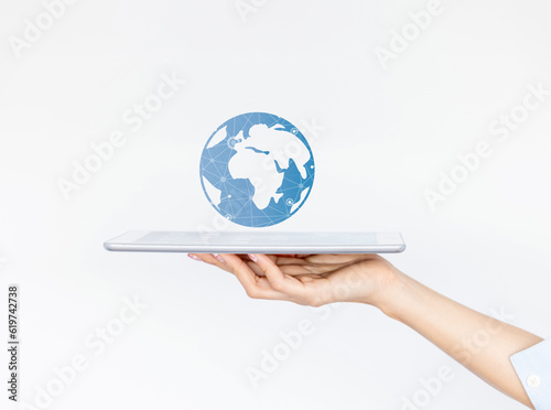 Fotografija Woman hand palm faced upwards holding laptop