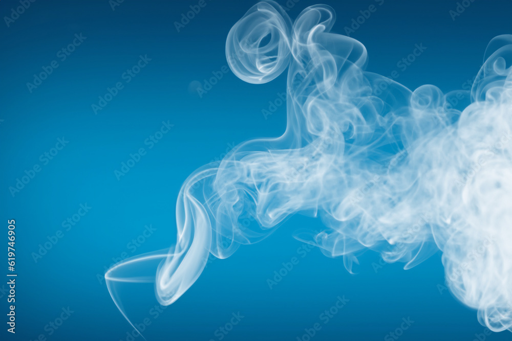 White smoke movement isolated on blue background, smoke movement concept for design