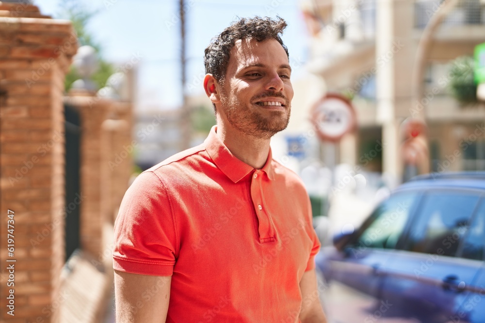 Young hispanic man smiling confident standing at street Young hispanic man smiling confident standing at street