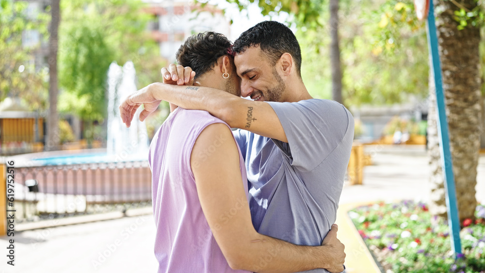 Two men couple smiling confident hugging each other at park Two men couple smiling confident hugging each other at park