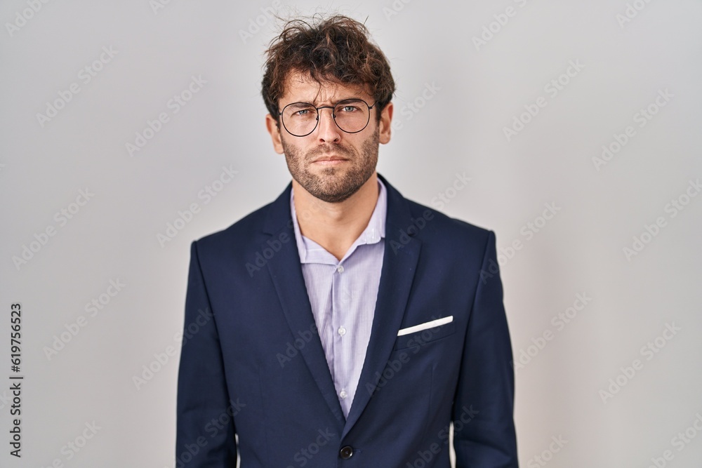 Hispanic business man wearing glasses skeptic and nervous, frowning upset because of problem. negative person. Hispanic business man wearing glasses skeptic and nervous, frowning upset because of problem. negative person.