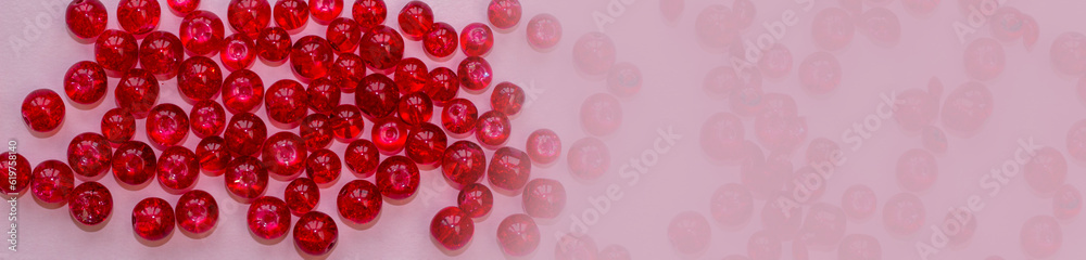red handicraft items, jewelry, beads, DIY background. Plastic acrylic glass beads of different shapes and colors for making brooches, pendants, collars. Blur effect. Weak focus. red handicraft items, jewelry, beads, DIY background. Plastic acrylic glass beads of different shapes and colors for making brooches, pendants, collars. Blur effect. Weak focus.