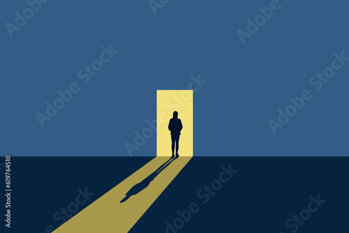 lonely girl stands in front of an open door on a gray walll vector illustration EPS10 photo
