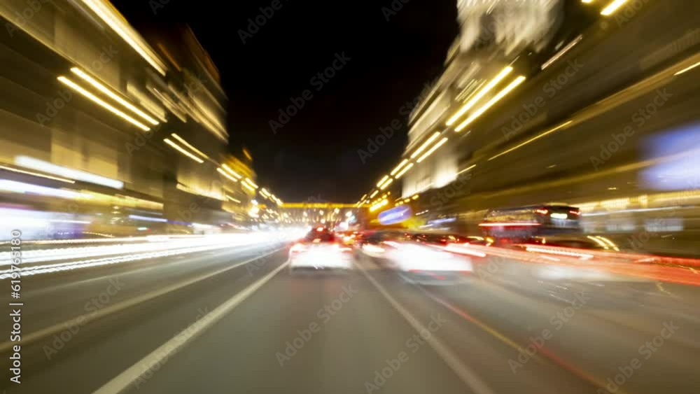 Motion of driving cars on night road in big city timelapse. Motion of driving cars on night road in big city timelapse.