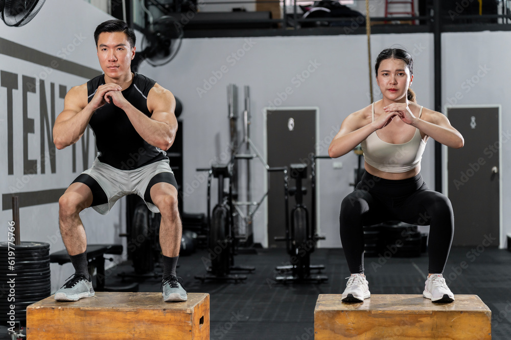 Asian men and women Have a strong body, good health, love to exercise. They are exercising together at the gym having fun. Asian men and women Have a strong body, good health, love to exercise. They are exercising together at the gym having fun.