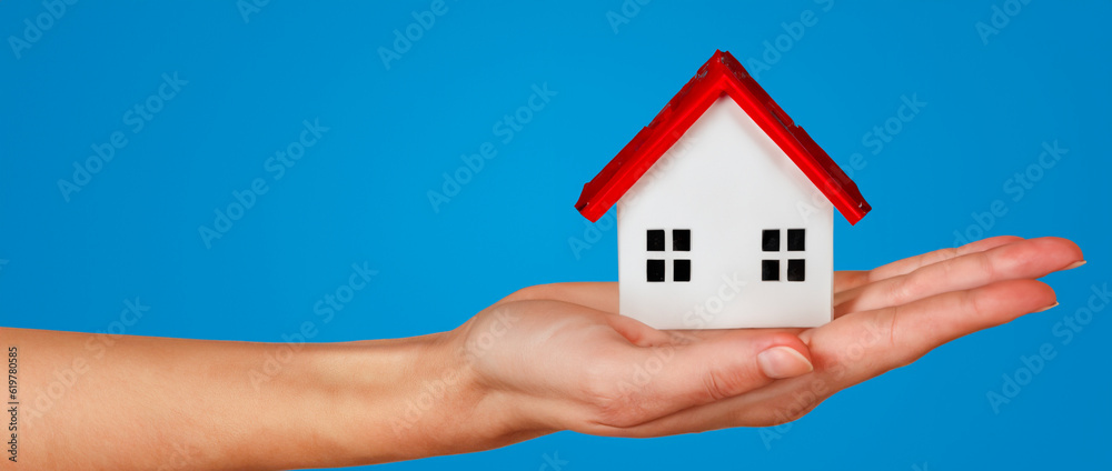 Wooden house with hand pointing to it. Sustainable, ecological house concept. Save to buy and rent a house. AI generative. Wooden house with hand pointing to it. Sustainable, ecological house concept. Save to buy and rent a house. AI generative.
