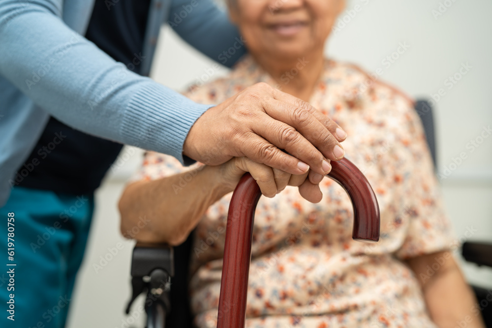 Caregiver help Asian elderly woman patient with love, care, encourage and empathy at nursing hospital, healthy strong medical concept.