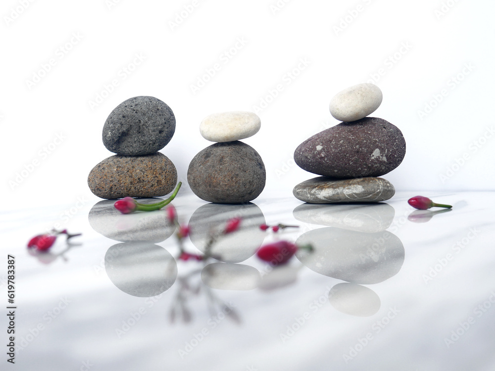 Pebbles with tropical flowers. Template for spa salon, cosmetic, massage or advertising