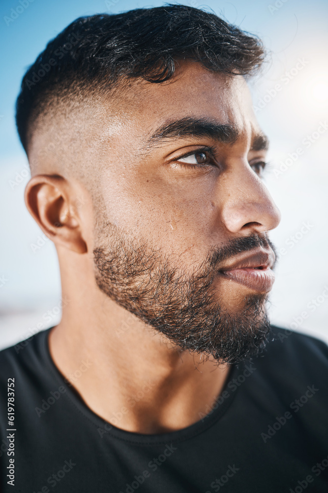 Thinking, fitness and closeup of man for exercise, marathon training and cardio workout in nature. Sports, blue sky and face of Indian male person outdoors for wellness, healthy body and running Thinking, fitness and closeup of man for exercise, marathon training and cardio workout in nature. Sports, blue sky and face of Indian male person outdoors for wellness, healthy body and running