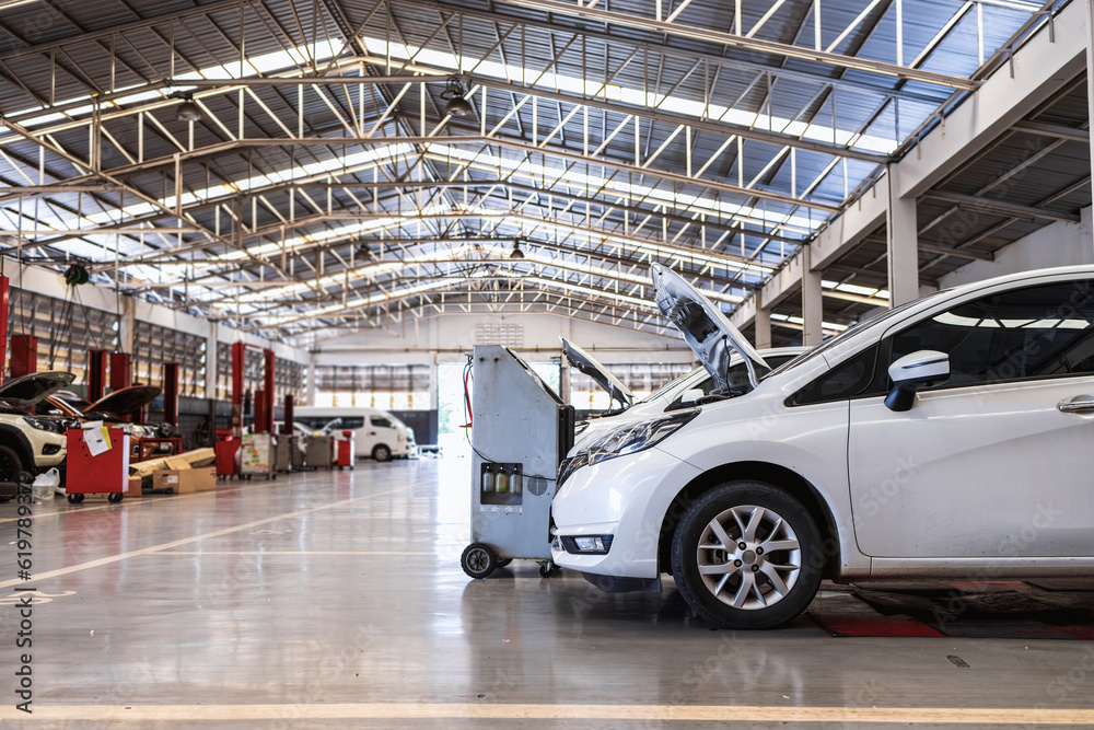 Expert Car Repair and Maintenance Services at the Industry's Premier Garage with soft-focus and over light in the background Expert Car Repair and Maintenance Services at the Industry's Premier Garage with soft-focus and over light in the background