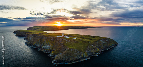 Sunset over Mull of Galloway Lighthouse from a drone, Mainland Scotland, UK photo