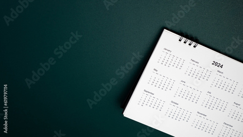 Calendar year 2024 schedule on green dark background. 2024 calendar planning appointment meeting concept. copy space. top view.