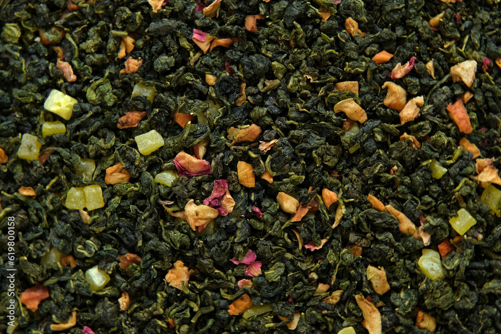 Loose Leaf Mango Pineapple Fruit Tea Wallpaper. Mix Black and Green Dry Tea Leaves. Close Up, Macro. Top View. Texture. Dried Tea is Spinning, Rotating. Abstract Food and Drink Background. Full Frame. Loose Leaf Mango Pineapple Fruit Tea Wallpaper. Mix Black and Green Dry Tea Leaves. Close Up, Macro. Top View. Texture. Dried Tea is Spinning, Rotating. Abstract Food and Drink Background. Full Frame.