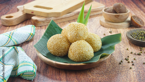 Sesame seed balls or onde onde is a traditional food from Indonesia made of glutinous rice flour green beans sesame seeds brown sugar served in a plate
