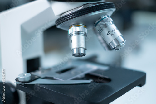 Close up of microscope in laboratory. Concept of science background, Research, chemist analysis. Substance experiment microbiology. Sample test and study. Technology science tool.