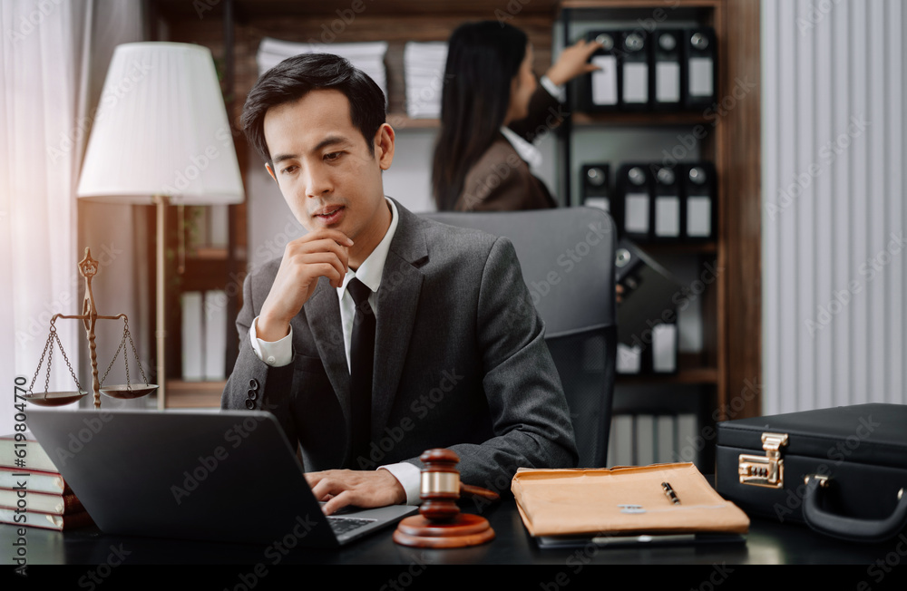Teamwork of business lawyer meeting working hard about legal legislation in courtroom to help their customer. Teamwork of business lawyer meeting working hard about legal legislation in courtroom to help their customer.