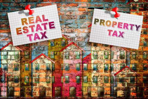 Property and Real Estate taxes concept with imaginary cityscape and information placard photo