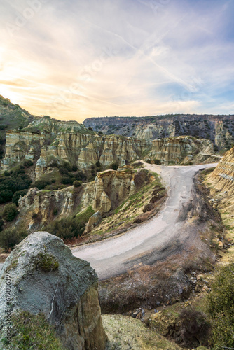 Fairy chimneys rock forms and sunset colors in the sky in Kula district of Manisa province