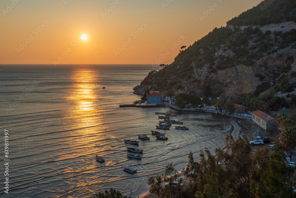 the tip of the Dilek peninsula national park in Aydın at sunset time ith boats and nature of aegean