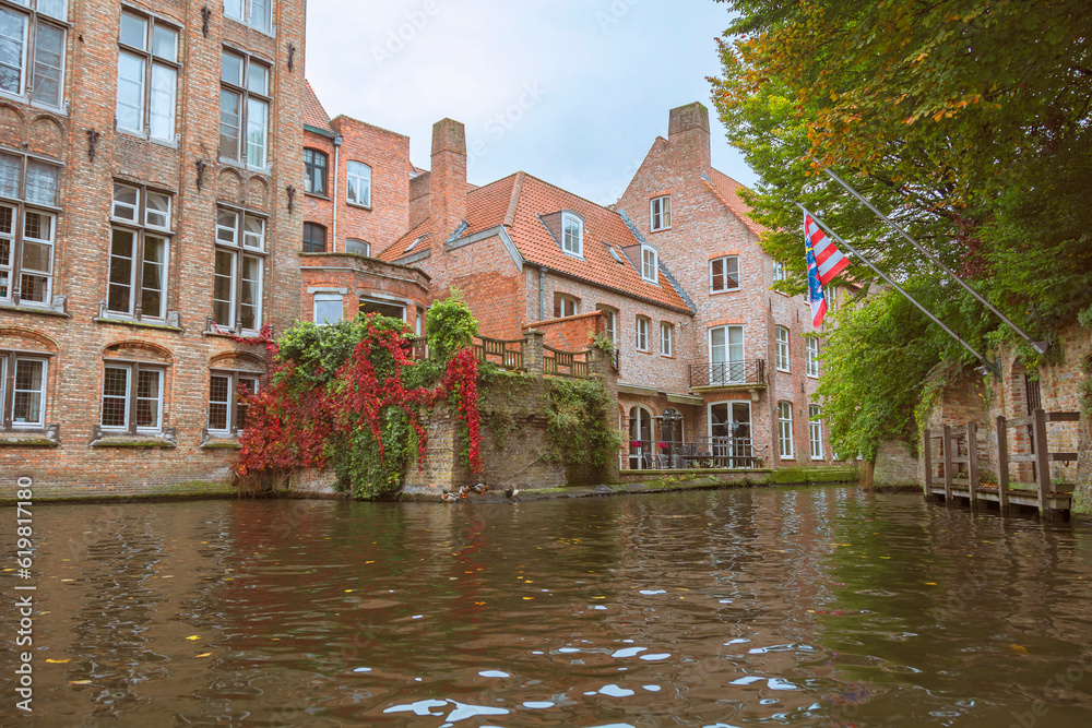 Bruges, Belgium. Historic center of the city. West Flanders Province, Belgium. Cityscape of Bruges (Brugge) with rozenhoedkaai canal.