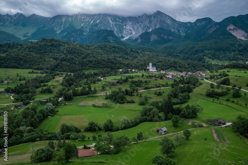 Dre  nica village  Slovenia. Drone aerial view. Picturesque rural green landscape