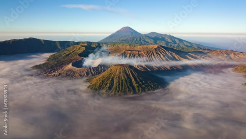 4K Hyperlapse aerial view flying to mount Bromo active volcano above sea of clouds, Java, Indonesia 
 photo