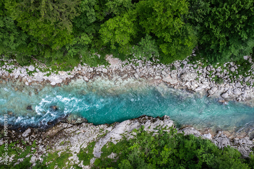 Aerial drone view of Soca river and green lush landscape in Slovenia at summer