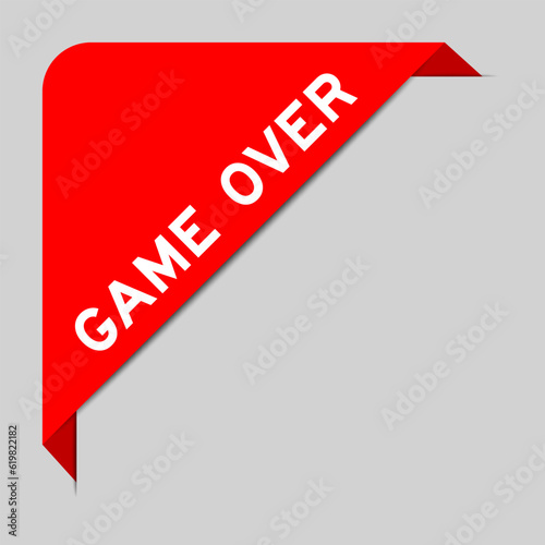 Red color of corner label banner with word game over on gray background