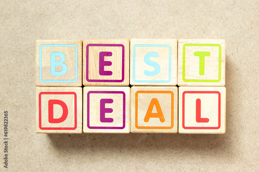 Wooden alphabet letter block in word best deal on wood background Wooden alphabet letter block in word best deal on wood background