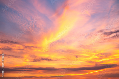 Fototapeta Naklejka Na Ścianę i Meble -  beautiful , luxury soft gradient orange gold clouds and sunlight on the blue sky perfect for the background, take in everning,Twilight